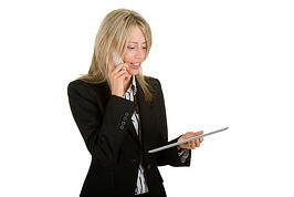 stock-photo-businesswoman-with-a-mobile-phone-and-a-tablet-computer-88769647